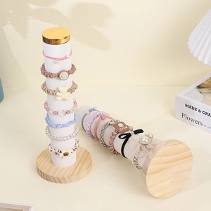 Velvet scrunchie holder stand with solid wood base and golden caps for hair accessories