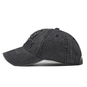 Close-up of NEW YORK embroidery on vintage washed cotton baseball cap with retro details