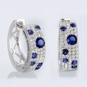 Silver hoop earrings with micro-paved white zircons and faceted round blue gemstones