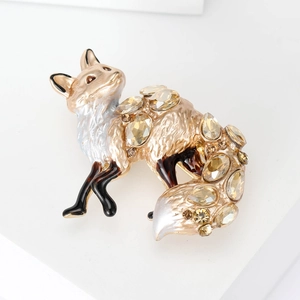 Detailed close-up of a fox brooch featuring gold alloy and champagne crystal stones