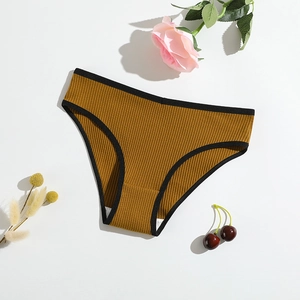 Women's yellow ribbed cotton panties with black trim on a clean white background