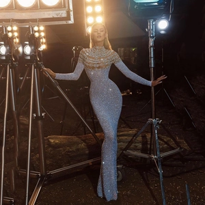 Elegant slim-fit silver sequin evening gown with high neck and long sleeves for women