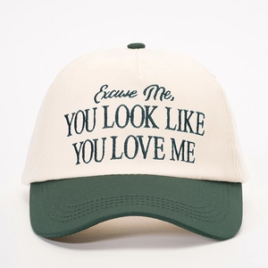 Two-tone cotton baseball cap with YOU LOOK LIKE YOU LOVE ME embroidery in beige and green