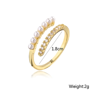 Detail view of 18K gold plated ring with micro-set pearls and cubic zirconia stones