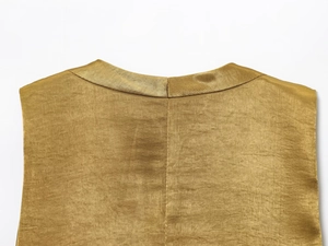 Detail shot of golden satin top fabric with premium metallic luster and fine stitching