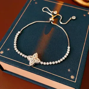 Sparkling silver flower charm bracelet with adjustable tennis chain and cubic zirconia
