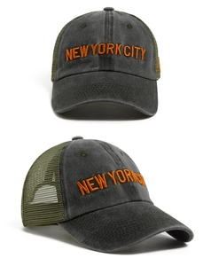 Detail of New York City embroidery on a washed cotton and mesh trucker baseball hat