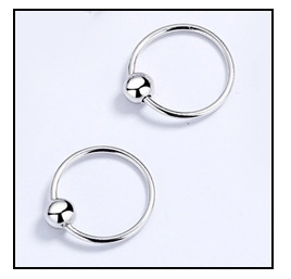 Close-up of polished silver s925 geometric captive bead ring body piercing jewelry