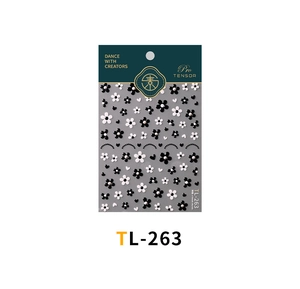 Detailed view of TL-263 3D black and white floral nail stickers with pearl accents