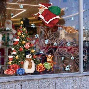 Weihnachtsfensteraufkleber mit Weihnachtsmann, Rentier und Schneemann auf Glasdisplay