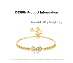 Detail of adjustable gold bracelet featuring a cubic zirconia butterfly charm and box chain