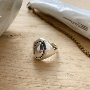 Retro 925 sterling silver oval ring with embossed edges and open adjustable band