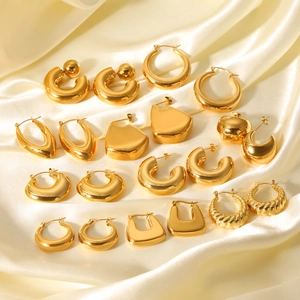 Detailed collection of 18K gold plated stainless steel geometric hoop earrings on silk