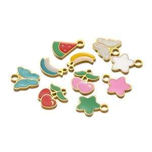 Detail of colorful enamel fruit and butterfly charms with gold trim for DIY necklaces