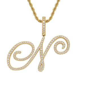Macro shot of 18K gold plated letter N pendant with pavé cubic zirconia on twist chain