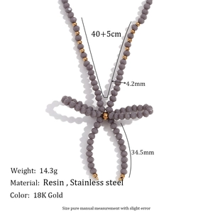 Collier artisanal en perles d'acier avec pendentif nœud en cristal gris pour femme