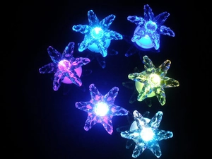 Detailed close-up of crystal flower LED decorative lights in various glowing colors