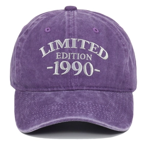 Detail of white 1990 Limited Edition embroidery on purple washed cotton baseball cap