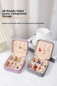 Detail view of velvet jewelry boxes with interior necklace hooks and ring compartments