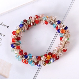 Close-up of colorful crystal beaded hair tie with handcrafted woven texture details