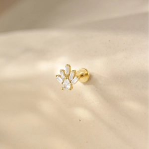 Detailed macro view of a 925 sterling silver gold stud earring with teardrop zircon stones