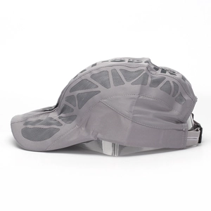 Detail view of quick-dry baseball cap featuring breathable grey mesh side panels