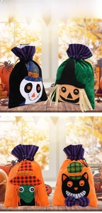 Detail view of four Halloween drawstring gift bags with witch, skull and pumpkin patterns