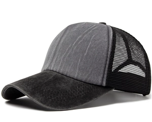 Detail of washed cotton trucker hat featuring breathable mesh and reinforced stitching