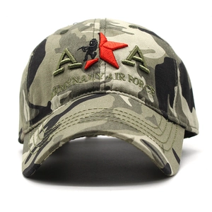 Detailed close-up of embroidered military AKA patch and army lettering on camouflage cap