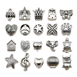 Detail of 20 silver alloy charms including heart, crown, and animal shapes for DIY bracelets
