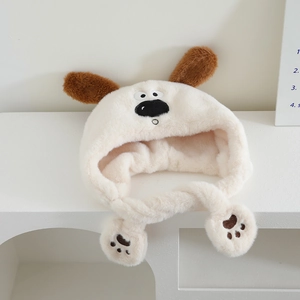 Detail of plush dog earflap hat showing fuzzy faux fur texture and paw embroidery