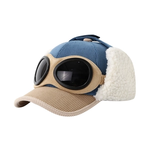 Blue corduroy aviator trapper hat for kids featuring pilot goggles and plush ear flaps