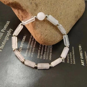 Detail of natural amethyst bead bracelet with rectangular stones and silver metal beads