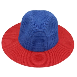 Top-down view of a two-tone blue and red woven straw Panama hat for sun protection