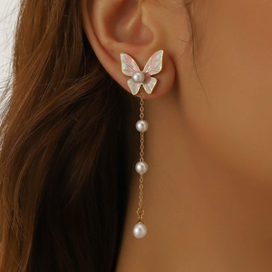 Pink and green enamel butterfly drop earrings with white pearls on a gold chain