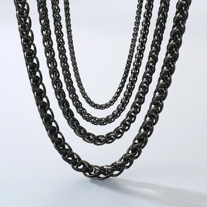 Close-up of black stainless steel wheat chains in five different thicknesses for men