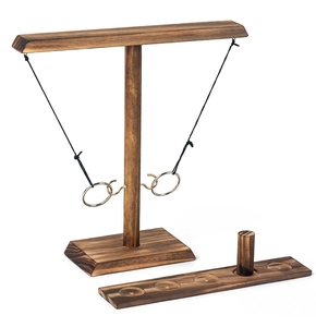 Detailed view of dark walnut wood ring toss game with metal hooks and scoring board