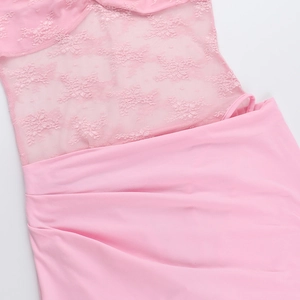 Detailed view of pink sheer lace and chiffon patchwork on a stylish high-waist dress