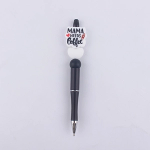 Detail of creative beaded pen with Mama Needs Coffee slogan and silicone bead topper