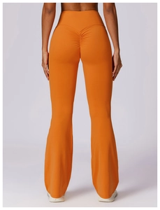Rear view of high-waisted orange flare yoga pants with scrunch butt lifting detail
