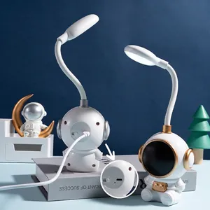 Creative astronaut LED desk lamp with adjustable neck and USB charging for students