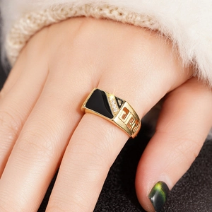 Retro gold geometric ring with black enamel, zircon inlay and Greek key pattern
