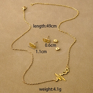 Flat lay of gold geometric heart jewelry set with necklace dimensions and weight specs