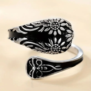 Detailed view of vintage sunflower open ring with silver finish and antique relief details