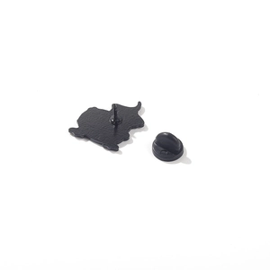 Detailed back view of metal duck brooch pin showing black rubber clutch and matte finish