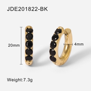 Detail view of gold huggie hoop earrings with black zircon stones and size specifications