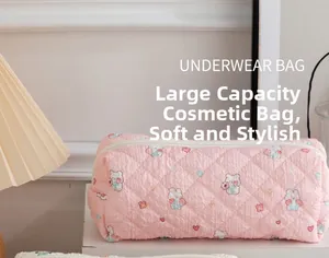 Pink quilted pouch with cute cartoon bears and heart patterns for cosmetic storage