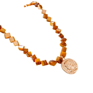 Vintage necklace with oval brown tiger eye beads and golden relief coin pendant