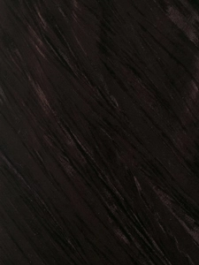 Detailed macro view of dark brown velvet fabric with diagonal twill texture and soft sheen