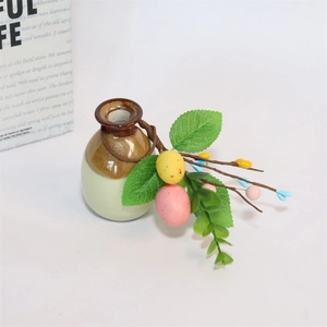Detail of Easter napkin ring featuring artificial eucalyptus leaves and colorful eggs